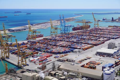 Aerial view of a container port with cargo ships